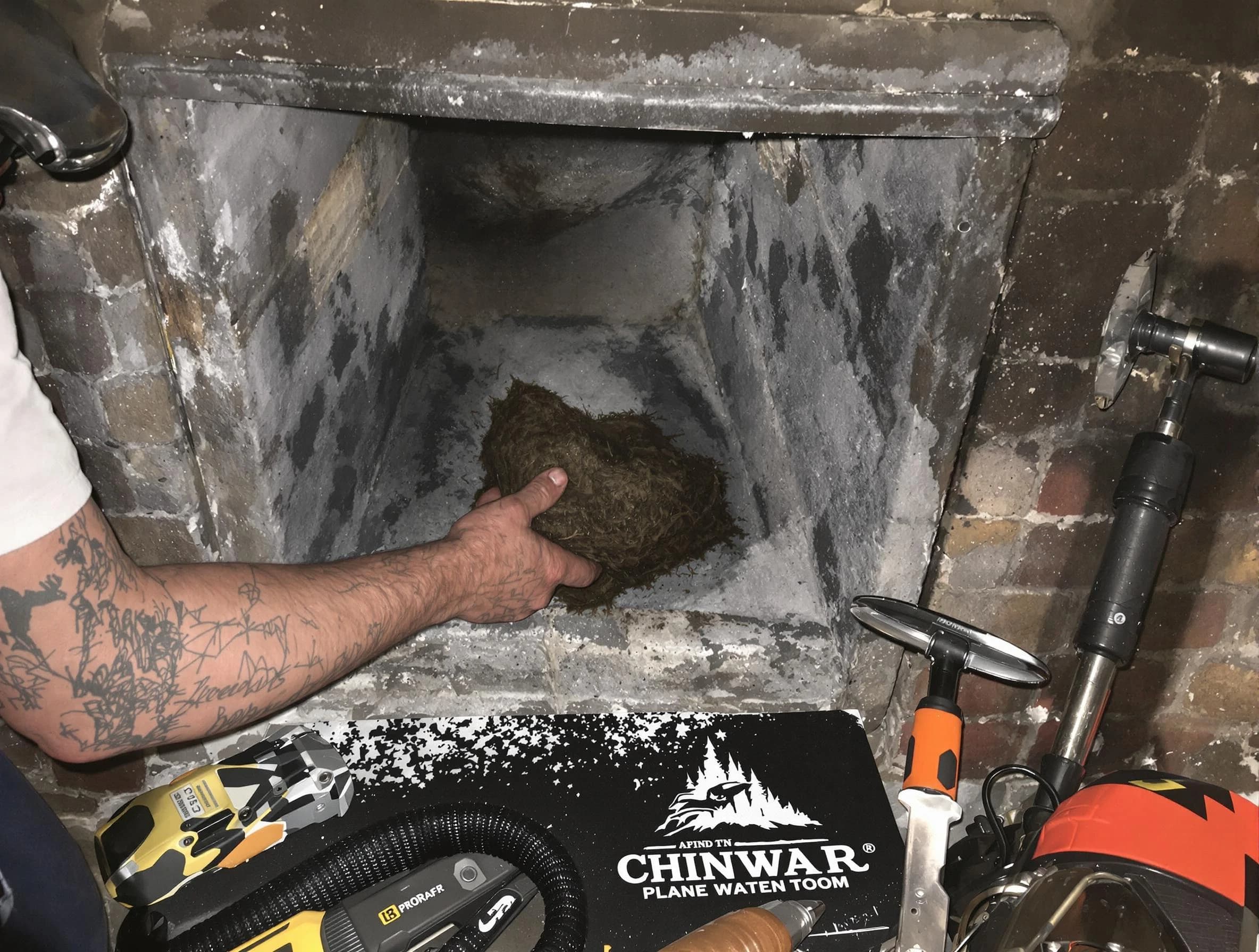 Peachtree City Chimney Sweep safely removing debris and screening chimney in Peachtree City, GA